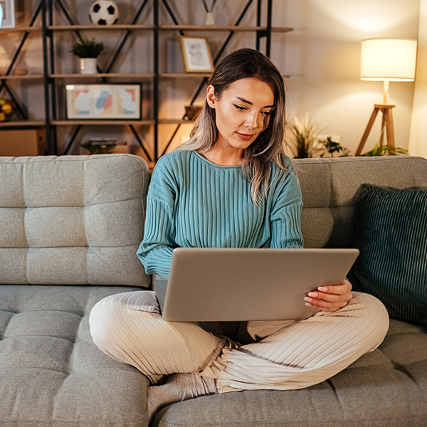 woman working on laptop at home